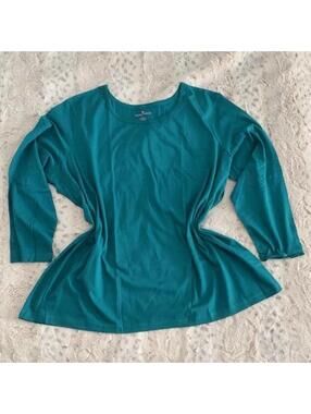 woman within teal cotton long sleeve top